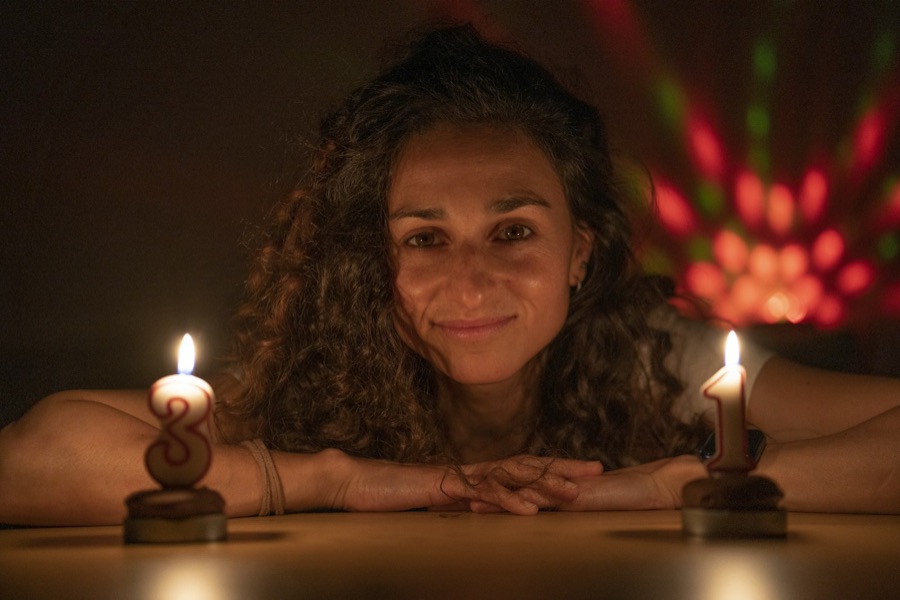 Woman lit by candlelight